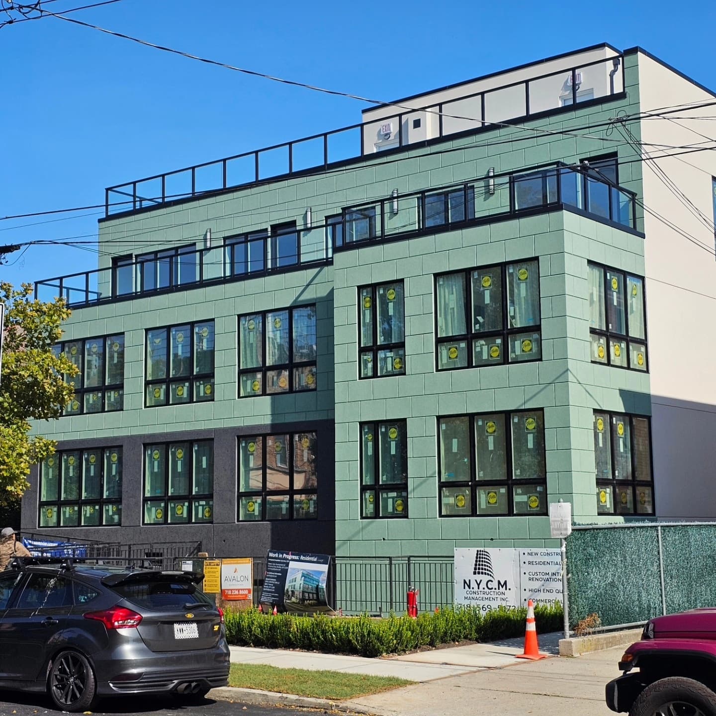 Street-facing facade with grouped dark-framed windows