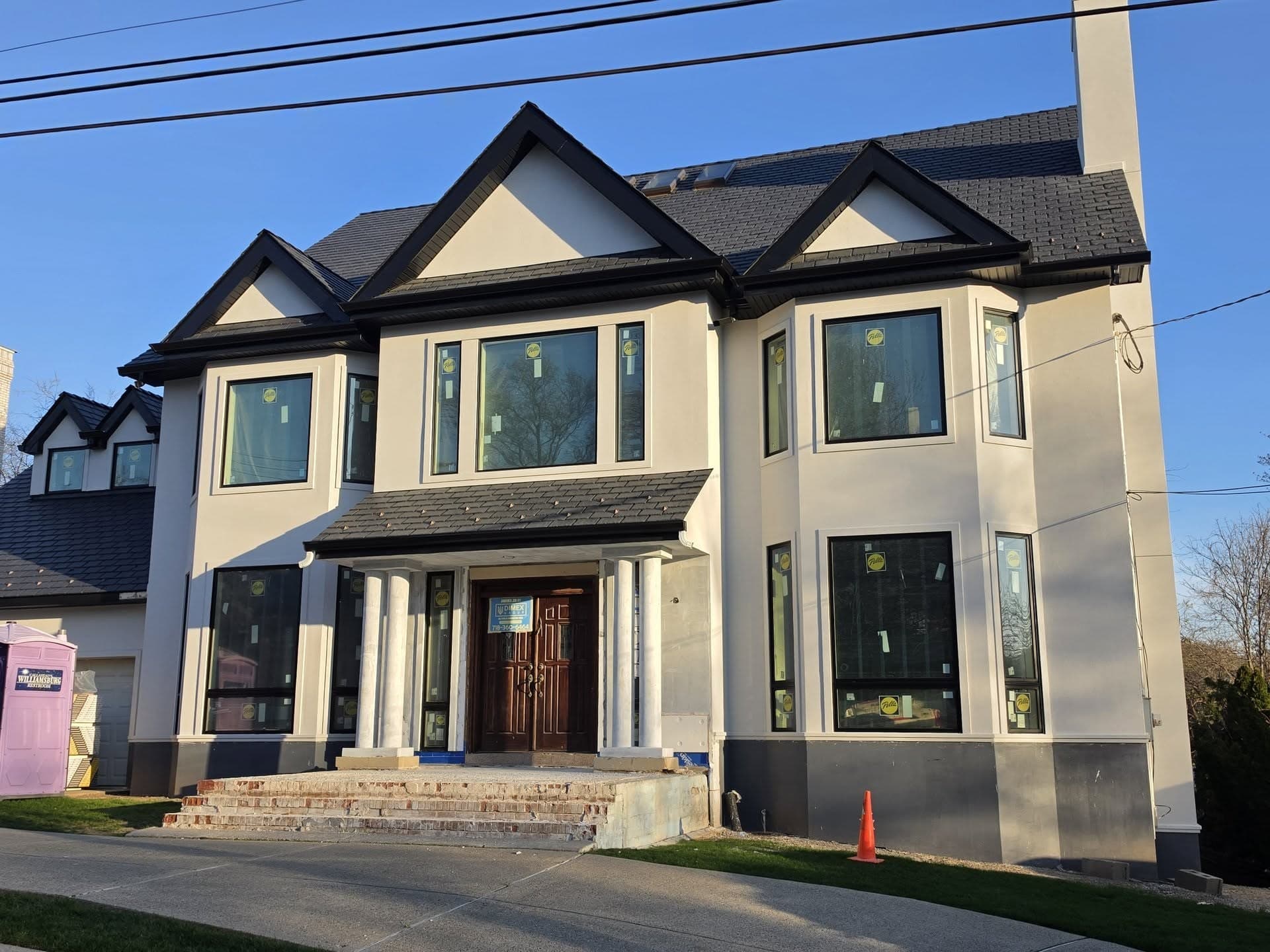 Light-colored residence with dark-framed windows