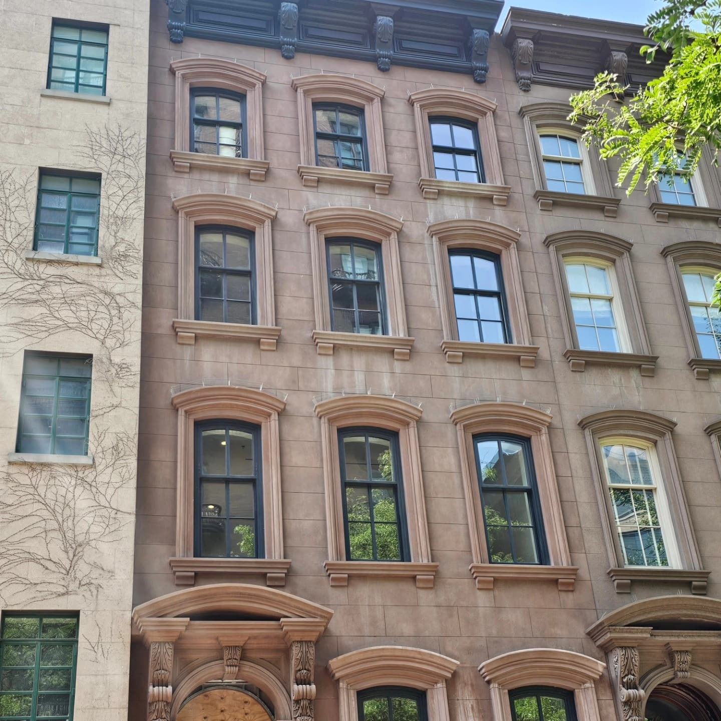 Second exterior view of the carved stone surrounds and window composition