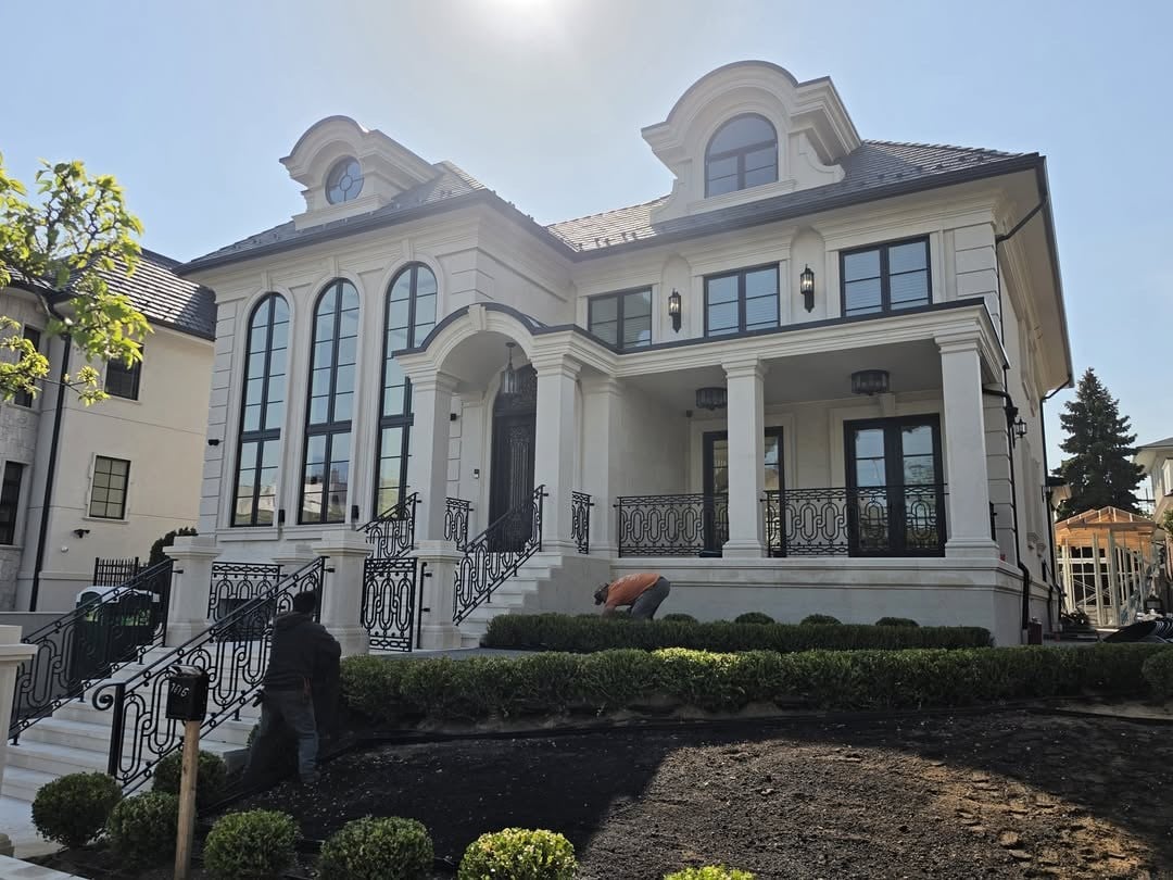 Traditional residence with tall arched and rectangular windows