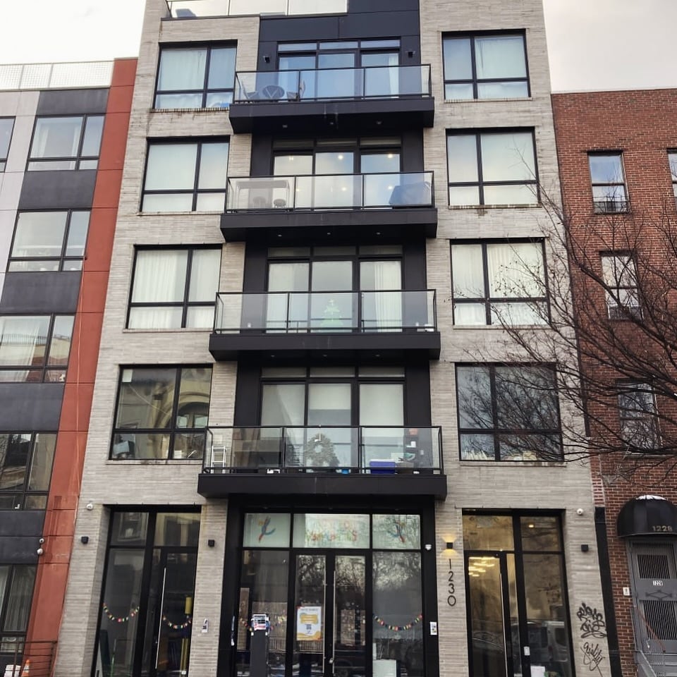 Full street-facing elevation with stacked balconies