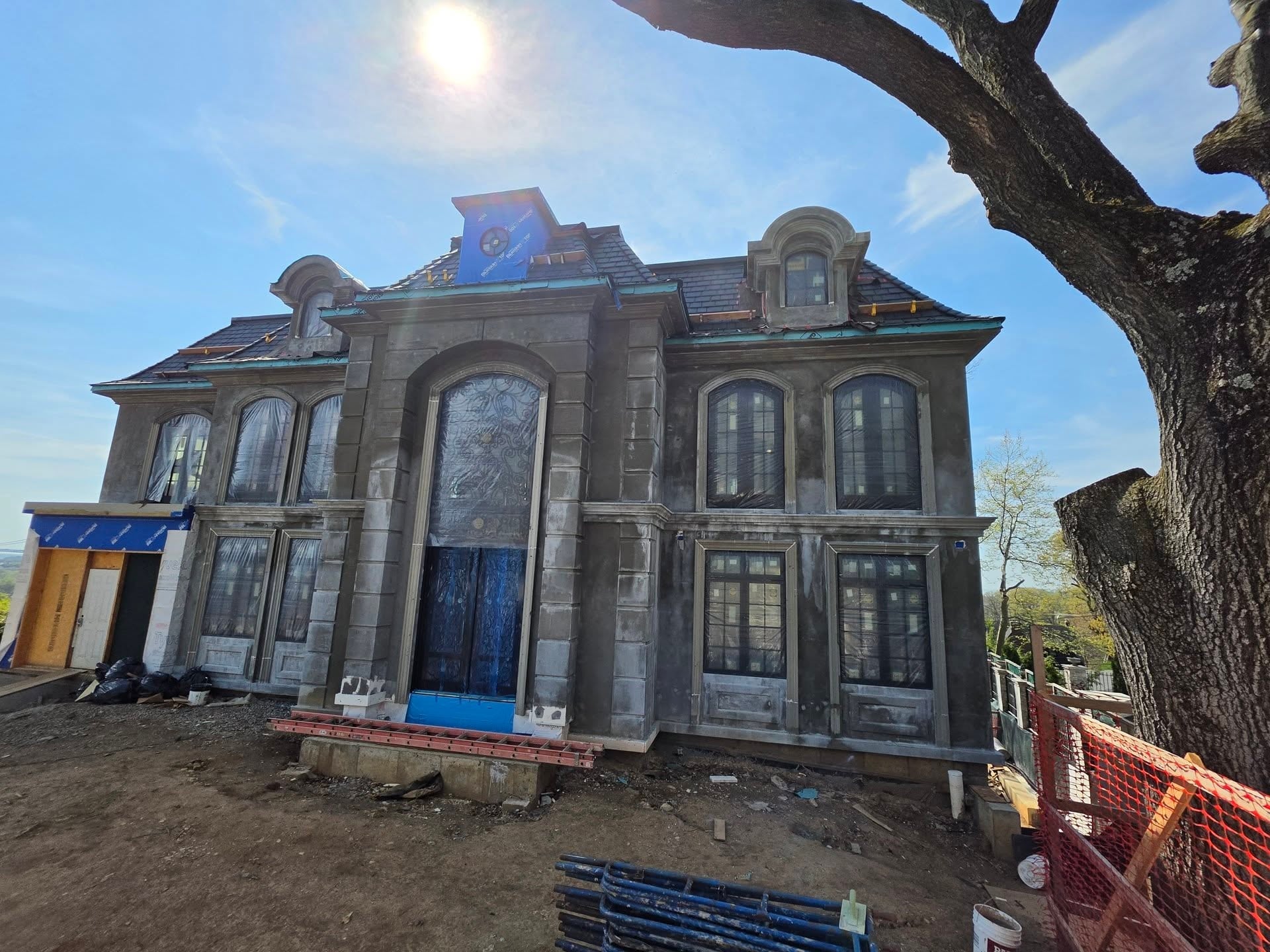 Front elevation of the classical residence during construction
