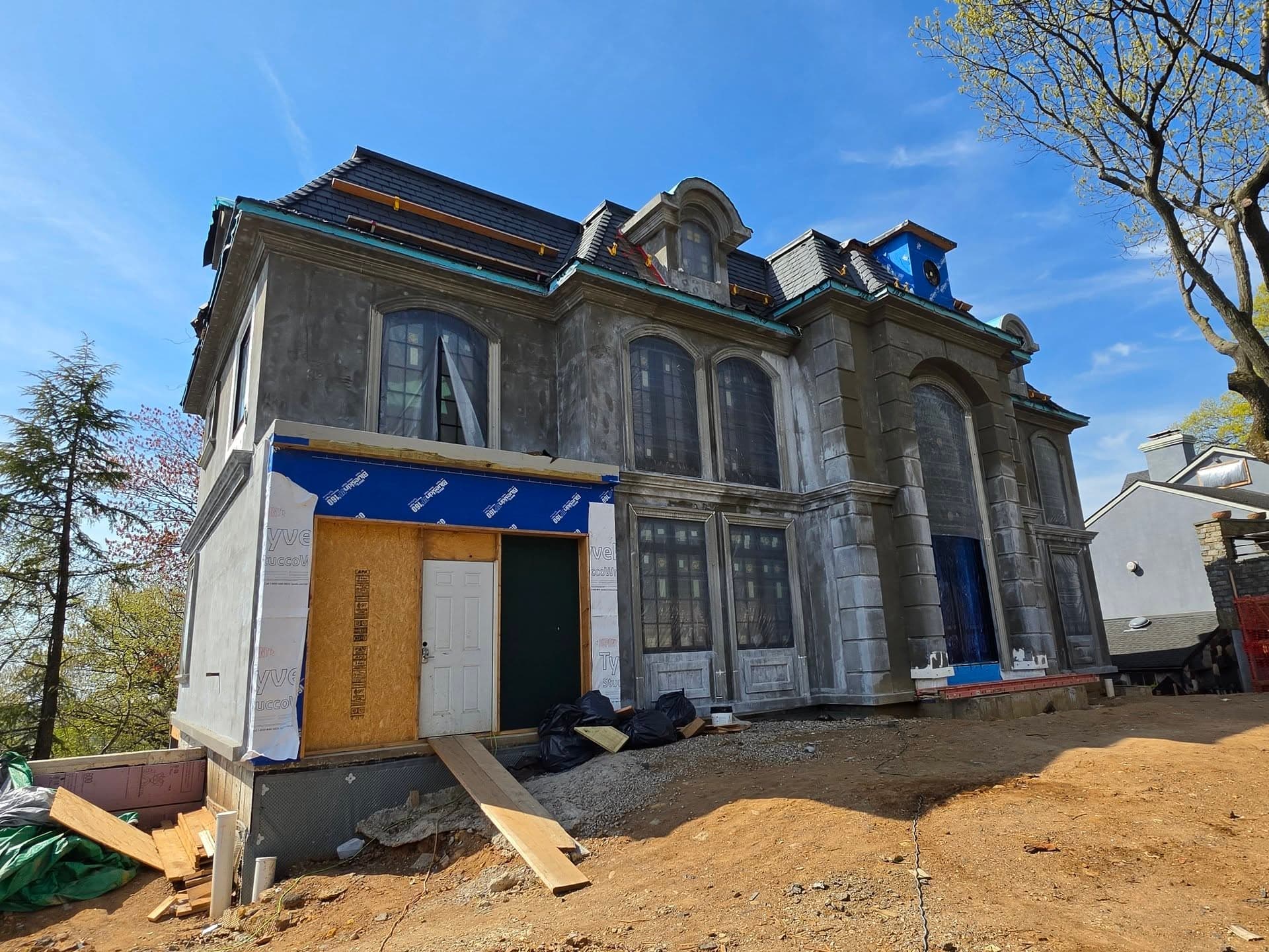 Angled view of the front facade and dormers