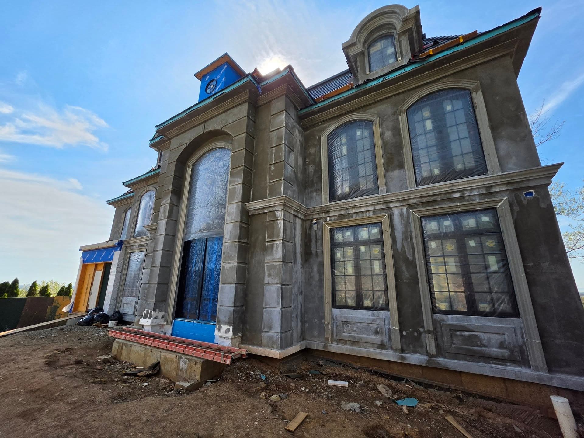 Tall central arched opening within the stone facade
