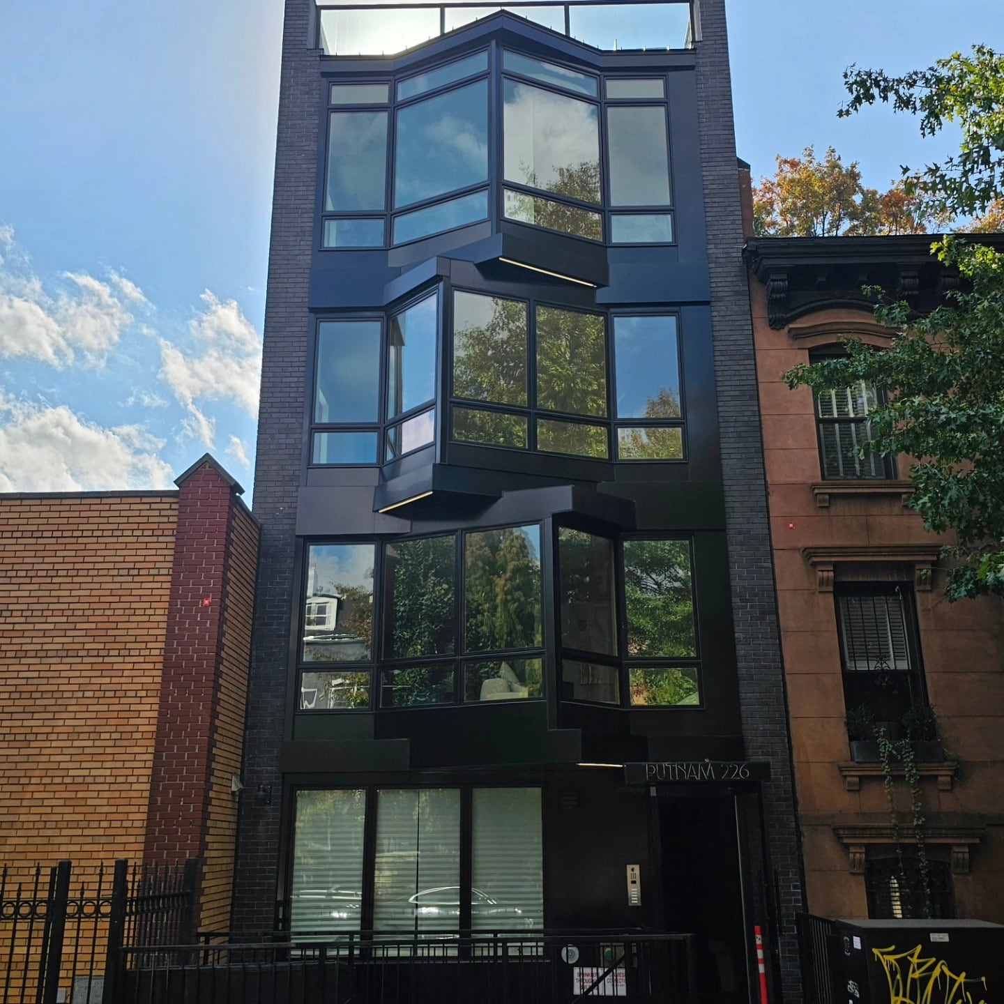 Street-facing elevation with stacked glazed bays