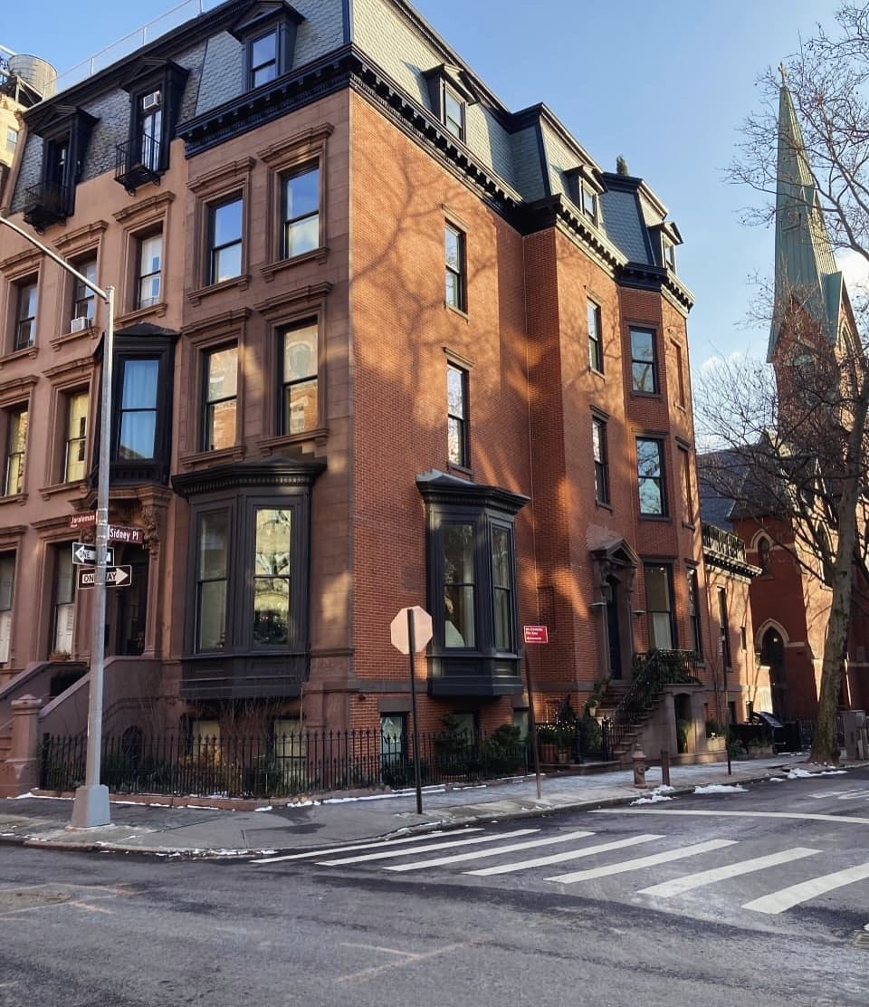 View across the street corner showing both elevations