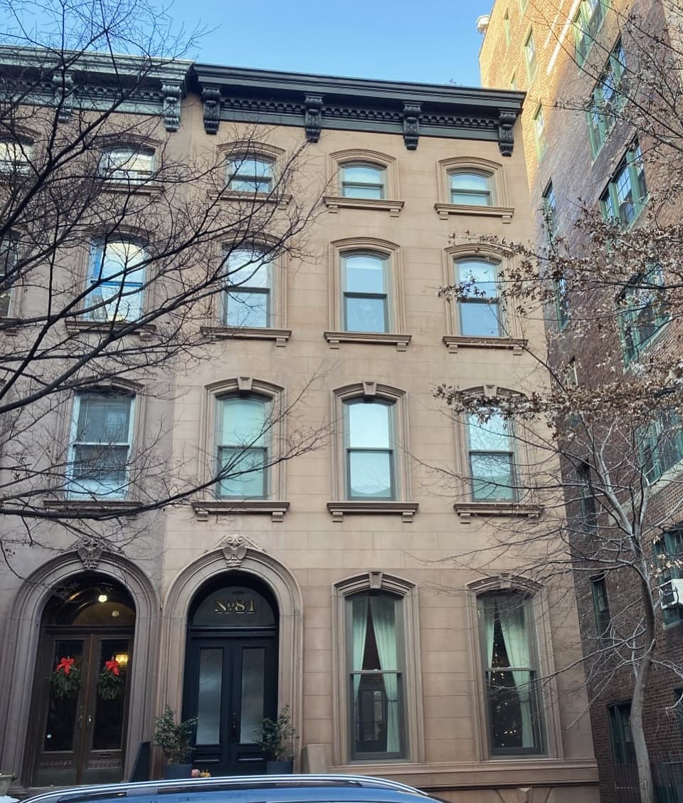 Second exterior view of the custom window profiles within the historic facade