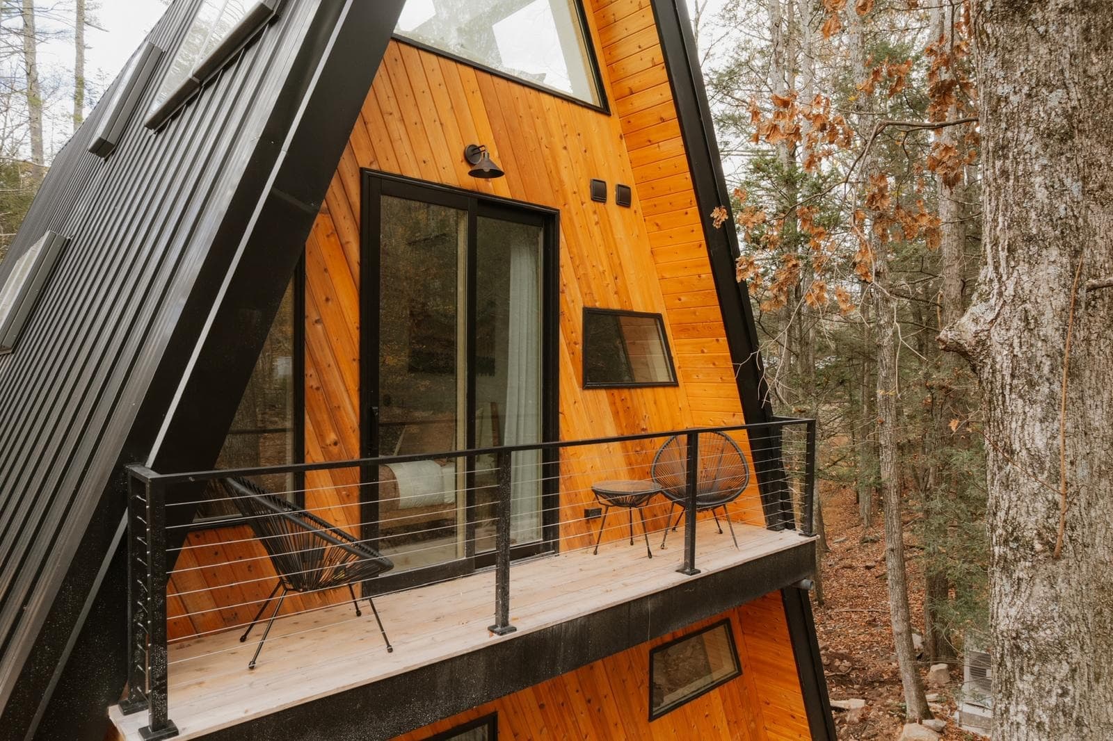 Glazed terrace entrance set into the side of the steep roof